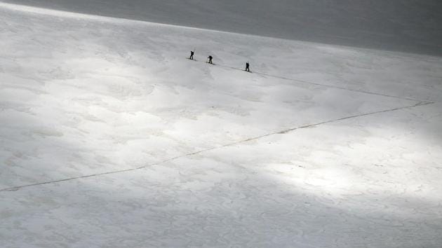 A group of scientists from the Austrian Institute for Interdisciplinary Mountain Research cross the Jamtalferner glacier near Galtuer, Austria. Scientists are racing to read a rapidly melting archive of climate data going back thousands of years - the insides of Austria’s Alpine glaciers. (Lisi Neisner / REUTERS) A group of scientists from the Austrian Institute for Interdisciplinary Mountain Research cross the Jamtalferner glacier near Galtuer, Austria. Scientists are racing to read a rapidly melting archive of climate data going back thousands of years - the insides of Austria’s Alpine glaciers. (Lisi Neisner / REUTERS)