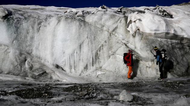Fischer and Bohleber inspect the thickness difference of the part of Schaufelferner glacier that is covered with a special fleece fabric protecting ice from sun and heat and the part that is not. The ablation of the unprotected part is up to 4 metres per year, three times faster than ice loss on the protected part. The scientists stand directly on unprotected parts in front of the ice shield. (Lisi Neisner / REUTERS) Fischer and Bohleber inspect the thickness difference of the part of Schaufelferner glacier that is covered with a special fleece fabric protecting ice from sun and heat and the part that is not. The ablation of the unprotected part is up to 4 metres per year, three times faster than ice loss on the protected part. The scientists stand directly on unprotected parts in front of the ice shield. (Lisi Neisner / REUTERS)