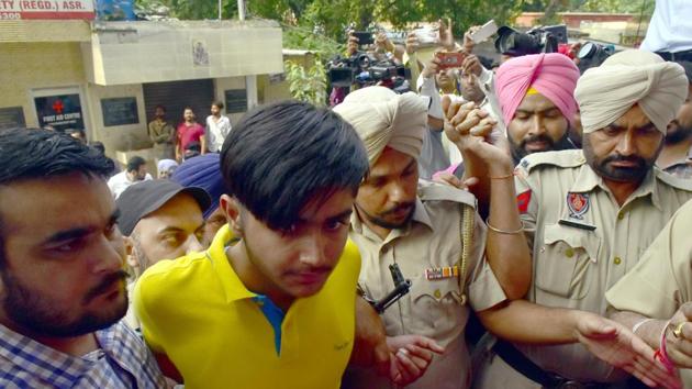 Counter intelligence wing of Punjab police producing four members of Khalistan Zindabad Force (KZF) in local court, in Amritsar on Monday.(Sameer Sehgal /HT PHOTO)