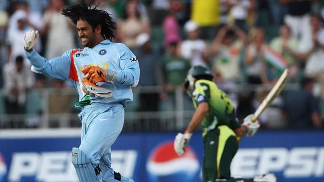 MS Dhoni of India celebrates his team's victory with Misbah-ul-Haq of Pakistan looking on the Twenty20 Championship Final match between Pakistan and India(Getty Images)