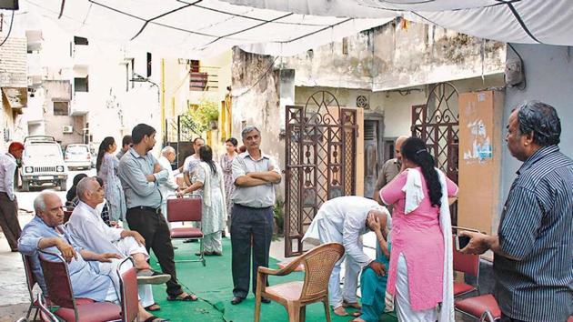 Relatives of Sushil Mehta, who was killed by his son, at their residence in Gurugram. (HT Photo) Relatives of Sushil Mehta, who was killed by his son, at their residence in Gurugram. (HT Photo)