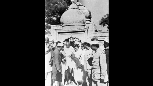 Gandhi outside the premises of Qutubuddin Bakhtiyar Kaki’s dargah, January 1948. That January, Gandhi sat on the last fast of his life in the wake of violence after partition. Maulana Abul Kalam Azad in ‘India wins Freedom’ notes that of the six conditions Gandhi put to end his fast, one was the contribution of Hindus and Sikhs in the repair of the Bakhtiyar Kaki shrine which had been damaged in communal riots. (National Gandhi Museum) Gandhi outside the premises of Qutubuddin Bakhtiyar Kaki’s dargah, January 1948. That January, Gandhi sat on the last fast of his life in the wake of violence after partition. Maulana Abul Kalam Azad in ‘India wins Freedom’ notes that of the six conditions Gandhi put to end his fast, one was the contribution of Hindus and Sikhs in the repair of the Bakhtiyar Kaki shrine which had been damaged in communal riots. (National Gandhi Museum)