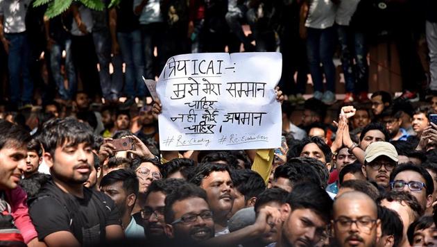 CA students during a protest against alleged error in evaluation of their answer sheets and demanding re-checking of their papers, outside the ICAI headquarters near the ITO office in New Delhi on Tuesday (ANI) CA students during a protest against alleged error in evaluation of their answer sheets and demanding re-checking of their papers, outside the ICAI headquarters near the ITO office in New Delhi on Tuesday (ANI)