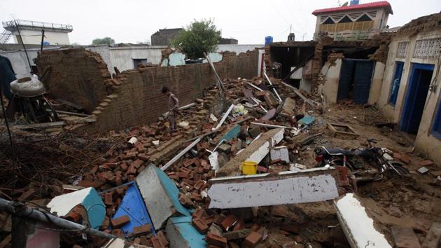 A boy walks through the rubble of his damaged house caused by a powerful earthquake at Sahang Kikri village near Mirpur, northeastern Pakistan, on, Sept. 25, 2019. Mourners were burying their dear ones in PoK where a powerful earthquake struck a day before. (AP) A boy walks through the rubble of his damaged house caused by a powerful earthquake at Sahang Kikri village near Mirpur, northeastern Pakistan, on, Sept. 25, 2019. Mourners were burying their dear ones in PoK where a powerful earthquake struck a day before. (AP)
