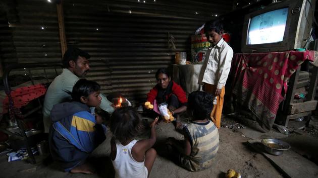 Siddharth Dhage, 10, and his family gather for breakfast at his home. Private water supply is something Garud and Dhage’s parents say they cannot afford. “Nowadays, I don’t get enough money to buy groceries. I can’t buy water from private suppliers,” said Dhage’s father, Rahul, a construction worker. “I am not getting work every day.” (Francis Mascarenhas / REUTERS) Siddharth Dhage, 10, and his family gather for breakfast at his home. Private water supply is something Garud and Dhage’s parents say they cannot afford. “Nowadays, I don’t get enough money to buy groceries. I can’t buy water from private suppliers,” said Dhage’s father, Rahul, a construction worker. “I am not getting work every day.” (Francis Mascarenhas / REUTERS)