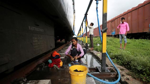 Anjali Gaikwad, 14, washes clothes at Aurangabad railway station. Gaikwad and her sisters, also board the train every few days to collect water and wash clothes. Their neighbour Prakash Nagre often tags along with soap and shampoo. “There’s no water to bathe at home,” he said. (Francis Mascarenhas / REUTERS) Anjali Gaikwad, 14, washes clothes at Aurangabad railway station. Gaikwad and her sisters, also board the train every few days to collect water and wash clothes. Their neighbour Prakash Nagre often tags along with soap and shampoo. “There’s no water to bathe at home,” he said. (Francis Mascarenhas / REUTERS)