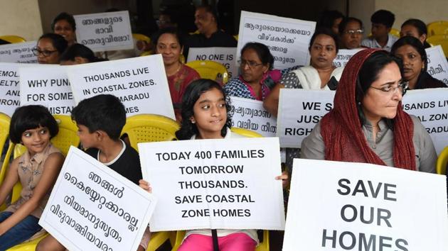 Kochi: Residents of various flats at Maradu, which have been ordered to be demolished by the Supreme Court, stage a protest in front of Holy Faith apartment, in Kochi, Sunday, Sept. 15, 2019. The Supreme Court had on Sept. 6 ordered the demolition of illegal flats in Kochi's Maradu Panchayat by Sept. 20 for violation of Coastal Regulation Zone (CRZ) rules.(PTI)