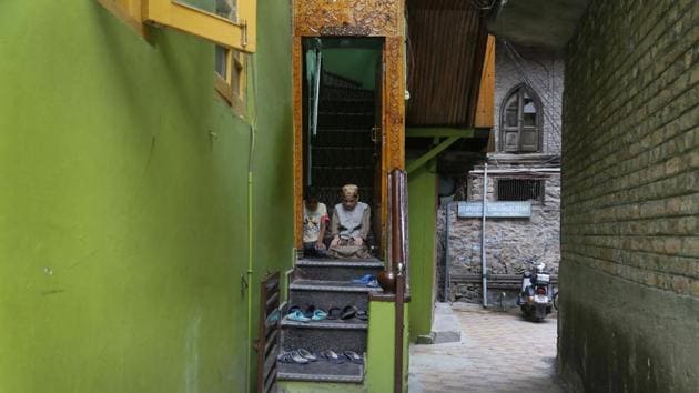 Boys offer Friday prayers at the doorway of a local mosque in an alley during curfew-like restrictions in Srinagar. Authorities have detained scores of teenagers to prevent them from joining or organizing new protests. (Mukhtar Khan / AP) Boys offer Friday prayers at the doorway of a local mosque in an alley during curfew-like restrictions in Srinagar. Authorities have detained scores of teenagers to prevent them from joining or organizing new protests. (Mukhtar Khan / AP)