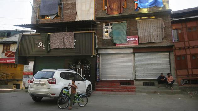 A boy stands with his bicycle as sheets cover windows of residential houses to protect them from stone-throwing, during a strike in Srinagar. Most of the top-level and second-rung separatist politicians have been taken into preventive custody while mainstream leaders, including two former chief ministers -- Omar Abdullah and Mehbooba Mufti -- have been either detained or placed under house arrest. (Mukhtar Khan / AP) A boy stands with his bicycle as sheets cover windows of residential houses to protect them from stone-throwing, during a strike in Srinagar. Most of the top-level and second-rung separatist politicians have been taken into preventive custody while mainstream leaders, including two former chief ministers -- Omar Abdullah and Mehbooba Mufti -- have been either detained or placed under house arrest. (Mukhtar Khan / AP)