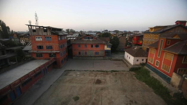 A school building stands isolated during a strike in Srinagar. Although some restrictions have been eased in the city, schools in the region remain closed. (Mukhtar Khan / AP) A school building stands isolated during a strike in Srinagar. Although some restrictions have been eased in the city, schools in the region remain closed. (Mukhtar Khan / AP)