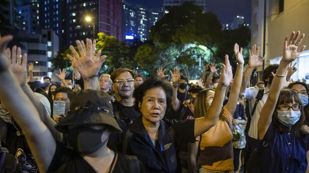 Police maintained a low presence near the venue but local media said 3,000 officers were on standby in case of clashes. (Bloomberg Photo) Police maintained a low presence near the venue but local media said 3,000 officers were on standby in case of clashes. (Bloomberg Photo)