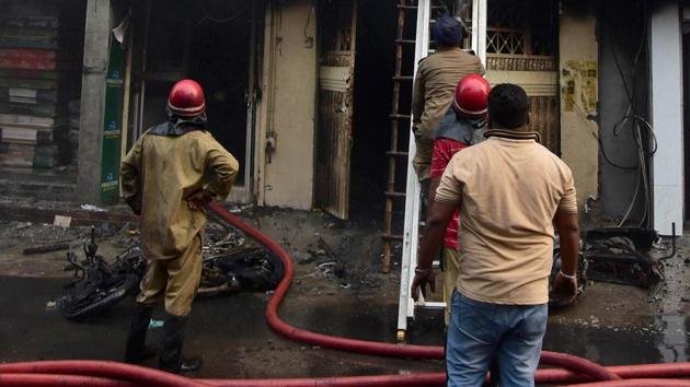 Firefighters trying to control the blaze at a mattress manufacturing unit-cum-residence in Chhawani Mohalla in Ludhiana on Thursday. (Gurpreet Singh/HT) Firefighters trying to control the blaze at a mattress manufacturing unit-cum-residence in Chhawani Mohalla in Ludhiana on Thursday. (Gurpreet Singh/HT)
