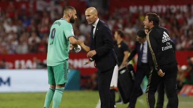 Real Madrid's head coach Zinedine Zidane, center, talks to Karim Benzema. (AP) Real Madrid's head coach Zinedine Zidane, center, talks to Karim Benzema. (AP)
