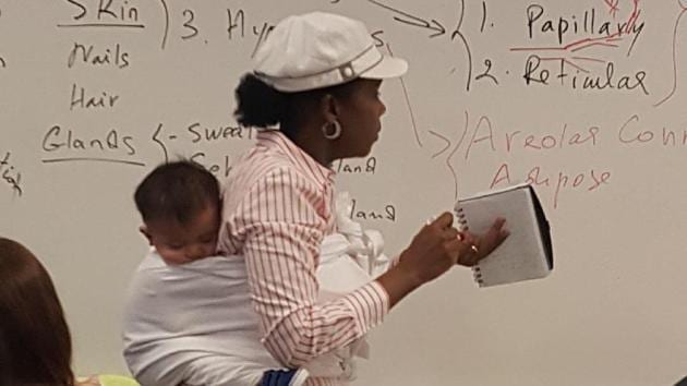 Twitter user @AnnaKhadejah, who is the professor’s daughter, tweeted a picture of her mother, Dr. Ramata Sissoko Cisse in class with the baby on her back. Twitter user @AnnaKhadejah, who is the professor’s daughter, tweeted a picture of her mother, Dr. Ramata Sissoko Cisse in class with the baby on her back.