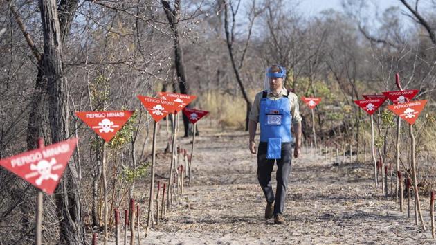Britain's Prince Harry walks through a minefield in Dirico, Angola, during a visit to see the work of landmine clearance charity the Halo Trust, on day five of the royal tour of Africa. Prince Harry is following in the footsteps of his late mother, Princess Diana, whose walk through an active mine field in Angola years ago helped to lead to a global ban on the deadly weapons. (Dominic Lipinski / AP) Britain's Prince Harry walks through a minefield in Dirico, Angola, during a visit to see the work of landmine clearance charity the Halo Trust, on day five of the royal tour of Africa. Prince Harry is following in the footsteps of his late mother, Princess Diana, whose walk through an active mine field in Angola years ago helped to lead to a global ban on the deadly weapons. (Dominic Lipinski / AP)