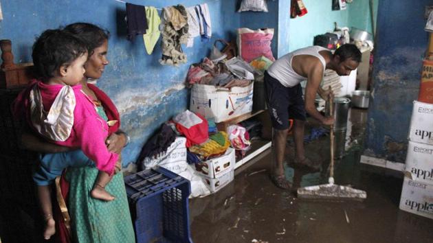 A man clears his home of water at Ambegaon Budruk in Pune. More than 28,000 people have been evacuated from low-lying areas. The Army rescued 300 people, including some stranded on rooftops and in the trees, from Solapur Road area, a defence spokesperson said. (Ravindra Joshi / HT Photo) A man clears his home of water at Ambegaon Budruk in Pune. More than 28,000 people have been evacuated from low-lying areas. The Army rescued 300 people, including some stranded on rooftops and in the trees, from Solapur Road area, a defence spokesperson said. (Ravindra Joshi / HT Photo)