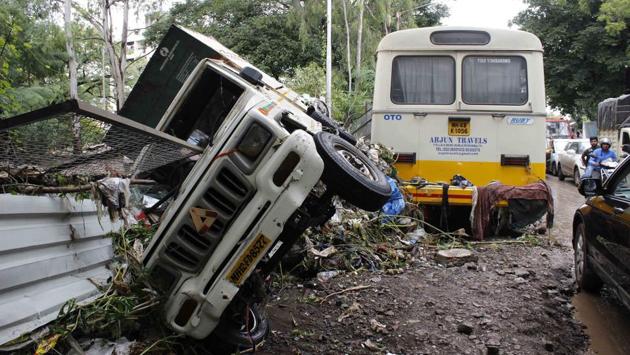 Vehicles damaged near Gaymukh crematorium at Narhe road, on Thursday. District Collector Naval Kishor Ram said that at least 59 villages in the district were affected by the floods. “We have communicated the whole situation to the Election Commission (as the model code of conduct is in force for October 21 Assembly polls) and appropriate aid will be provided to the victims soon,” he said. (Ravindra Joshi / HT Photo) Vehicles damaged near Gaymukh crematorium at Narhe road, on Thursday. District Collector Naval Kishor Ram said that at least 59 villages in the district were affected by the floods. “We have communicated the whole situation to the Election Commission (as the model code of conduct is in force for October 21 Assembly polls) and appropriate aid will be provided to the victims soon,” he said. (Ravindra Joshi / HT Photo)