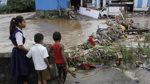 Children look on at water logged in Kondhre Industrial Estate on Narhe road on Thursday. Pune District Collector Naval Kishore Ram declared a holiday for September 27 for colleges and schools in Pune city, Purandar, Baramati, Bhor and Haveli tehsil. Schools and colleges in many places had declared a holiday on Thursday as well in view of the downpour. (Ravindra Joshi / HT Photo) Children look on at water logged in Kondhre Industrial Estate on Narhe road on Thursday. Pune District Collector Naval Kishore Ram declared a holiday for September 27 for colleges and schools in Pune city, Purandar, Baramati, Bhor and Haveli tehsil. Schools and colleges in many places had declared a holiday on Thursday as well in view of the downpour. (Ravindra Joshi / HT Photo)