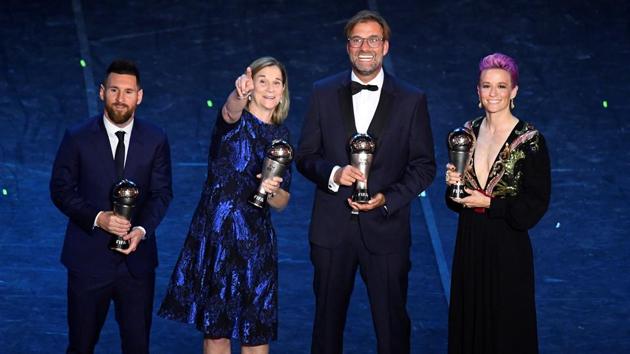 FC Barcelona's Lionel Messi poses after winning the Best FIFA Men's player award with the winner of the Best FIFA Men's coach award Liverpool manager Juergen Klopp, winner of the Best FIFA Women's player award USA's Megan Rapinoe and the winner of the Best FIFA Women's coach award USA's coach Jill Ellis. (Flavio Lo Scalzo / REUTERS) FC Barcelona's Lionel Messi poses after winning the Best FIFA Men's player award with the winner of the Best FIFA Men's coach award Liverpool manager Juergen Klopp, winner of the Best FIFA Women's player award USA's Megan Rapinoe and the winner of the Best FIFA Women's coach award USA's coach Jill Ellis. (Flavio Lo Scalzo / REUTERS)