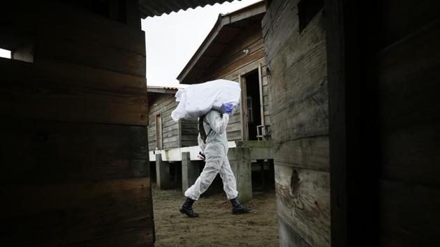 A police officer carries a sack of confiscated drugs to be destroyed during a disposal operation near the mouth of the Bayano River, near Chepo, Panama. Public security agents in Panama incinerated more than 24 tons of cocaine in an area away from communities. (Arnulfo Franco / AP) A police officer carries a sack of confiscated drugs to be destroyed during a disposal operation near the mouth of the Bayano River, near Chepo, Panama. Public security agents in Panama incinerated more than 24 tons of cocaine in an area away from communities. (Arnulfo Franco / AP)