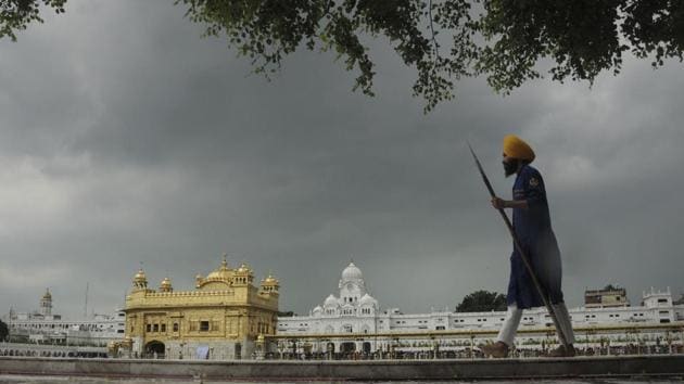 Dark clouds hover over the Golden Temple, in Amritsar, Punjab. (PTI) Dark clouds hover over the Golden Temple, in Amritsar, Punjab. (PTI)