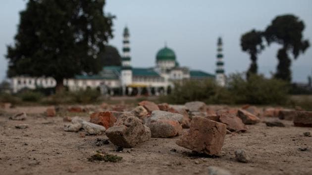 Bricks, used for stone pelting against security forces during protests, lie on the ground next to Jinab Sahib mosque in Anchar neighbourhood. The decision to abrogate Article 370 was passed by the parliament on August 5 in Jammu and Kashmir, the country’s only Muslim-majority state. (Danish Siddiqui / REUTERS)