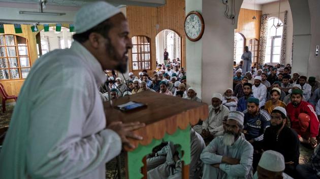 Hayat Ahmed Bhat, a Kashmiri activist speaks to residents before Friday prayers and protests inside a mosque in Anchar neighbourhood. While some normalcy has returned to the region more than seven weeks after the crackdown began, there is little sign of an end to the standoff in Anchar, home to about 15,000 people. (Danish Siddiqui / REUTERS)