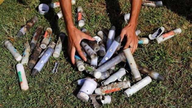 A man shows tear gas shells and stun grenades fired by security forces during protests in Anchar neighbourhood, during restrictions. Prime Minister Narendra Modi has said Kashmir’s special status, which allowed only residents to buy property and hold government jobs, restricted its development and encouraged a separatist revolt that has killed 40,000 people since 1989. (Danish Siddiqui / REUTERS)