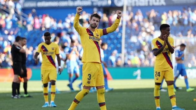 Barcelona's Gerard Pique celebrates after the match.(REUTERS)