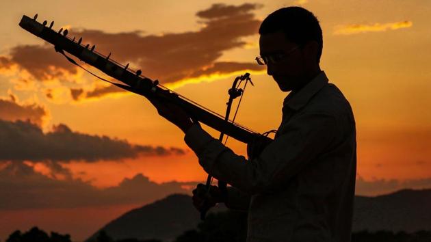 A man plays Ravanahatha, a traditional stringed instrument in Pushkar, Rajasthan. (PTI) A man plays Ravanahatha, a traditional stringed instrument in Pushkar, Rajasthan. (PTI)