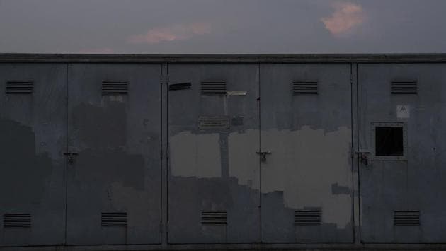An electric box has been painted over to hide anti-government graffiti against the sunset in Hong Kong. Wearing tinted sunglasses, a mask and a helmet, a scrawny teenager hastily sprayed “Sell Hong Kong” at New Town Plaza in Shatin before darting away with a group of protesters upon the arrival of police. Like most, he is a novice when it comes to the art of graffiti. (Vincent Yu / AP) An electric box has been painted over to hide anti-government graffiti against the sunset in Hong Kong. Wearing tinted sunglasses, a mask and a helmet, a scrawny teenager hastily sprayed “Sell Hong Kong” at New Town Plaza in Shatin before darting away with a group of protesters upon the arrival of police. Like most, he is a novice when it comes to the art of graffiti. (Vincent Yu / AP)