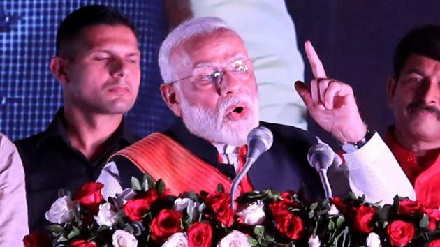 Prime Minister Narendra Modi addresses the crowd as he arrives after concluding his 7-days visit the United States of America, at Palam Technical Airport in New Delhi on Saturday.(ANI photo)