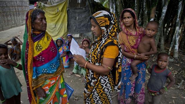 Women check their eligibility for NRC, in Assam.(HT ARCHIVE) Women check their eligibility for NRC, in Assam.(HT ARCHIVE)