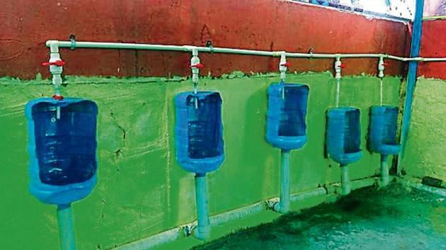 Schoolboys make toilets from plastic water bottles.(HT file)