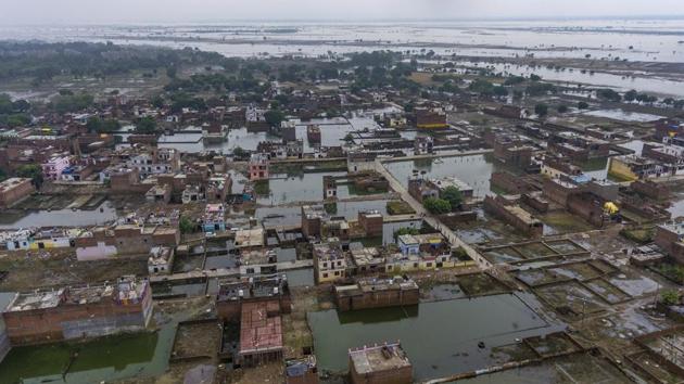 Houses are inundated with floodwaters in Prayagraj, Uttar Pradesh. Sandhaya Kureel, a spokeswoman of the Disaster Management and Relief Department, said most of the fatalities in Uttar Pradesh have been caused by house collapses, lightning and drowning. (Rajesh Kumar Singh / AP)