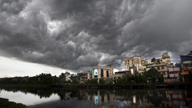 Monsoon clouds hover over the city in Guwahati, Assam. “We cannot announce monsoon withdrawal unless it stops raining in northwest India. It is still raining in Gujarat and Rajasthan. Anti-cyclone hasn’t established,” said Mohapatra. (Anupam Nath / AP)