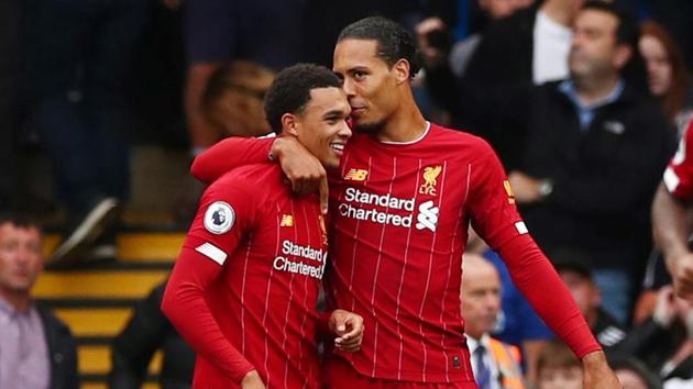 Liverpool's Trent Alexander-Arnold celebrates scoring their first goal with Virgil van Dijk.(REUTERS)