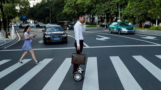 A man rides a hoverboard in the business district of Guanghzou. A city of 14 million, Guangzhou is no stranger to the disruption brought about by breakneck economic change. Once China’s only port open to foreign trade, Guangzhou prides itself on being a bastion of southern Chinese culture and thought. The city has thrived since China opened itself to the outside world in the late 1970s. (Jorge Silva / REUTERS)