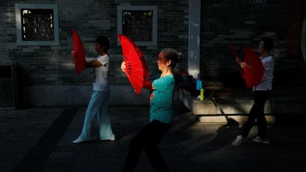 Women practise tai-chi in the early morning at a park in Liwan. Guangzhou’s economic growth has started to slow, along with the rest of the country. But much of the traditional life in the city remains. Older citizens practise ‘tai chi’ and dance together for exercise and companionship in the public spaces. (Jorge Silva / REUTERS)
