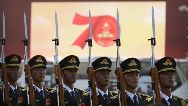 Members of a Chinese military honour guard stand at attention during a rehearsal before the parade in Beijing. In his speech, Xi said China “must adhere” to the one country, two systems policy governing Hong Kong and “maintain the long-term prosperity and stability” of the city. (Mark Schiefelbein / AP)