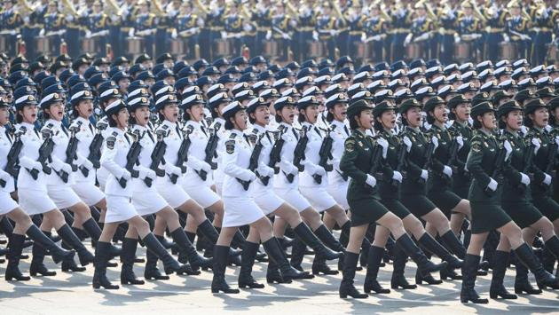 Chinese troops march during a military parade in Tiananmen Square in Beijing. The event was meant to showcase China’s journey from a poor nation broken by war to the world’s second largest economy. Xi, who wore the distinctive “Mao suit”, delivered a speech invoking the “Chinese dream” of national rejuvenation -- his grand vision of restoring the country to perceived past glory. (Greg Baker / AFP)