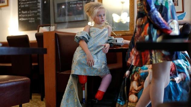 Demetre during a photo shoot a day before the show. She uses carbon blades for running and on the catwalk - she even did a cartwheel in them at the London show - but for school she has a different set of prosthetic legs. (Gonzalo Fuentes / REUTERS)