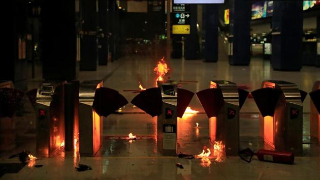 Fires are seen at Tai Wai Station during an anti-government demonstration in Hong Kong. Tsang, who was filmed trying to strike the officer with a pole as he was shot, was taken to a nearby hospital in a critical condition but authorities said his condition had since improved. “According to the latest information of the Hospital Authority, the current condition of the man is stable,” the government said in a statement. (Jorge Silva / REUTERS)