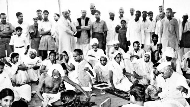 Gandhi and Jawaharlal Nehru spinning, Delhi.(National)