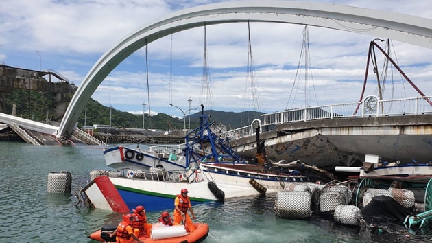 Ten people were taken to hospitals with injuries, including the Taiwanese driver of an oil tanker truck that fell off the bridge.(AP image)