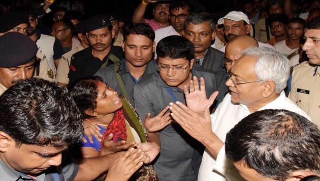 Bihar Chief Minister Nitish Kumar meets with flood-affected residents in Patna.(PTI photo)
