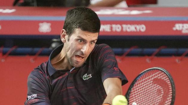 Tokyo: Novak Djokovic of Serbia plays a shot against Australian Alexei Popyrin.(AP)
