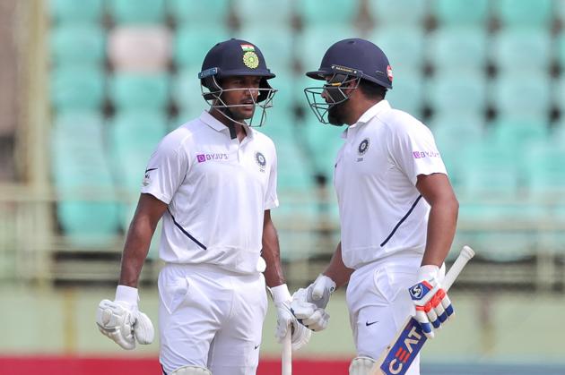 India's Rohit Sharma, right, and Mayank Agarwal, left, cheer each other as they bat during the first day of the first cricket Test match against South Africa in Visakhapatnam. (AP)