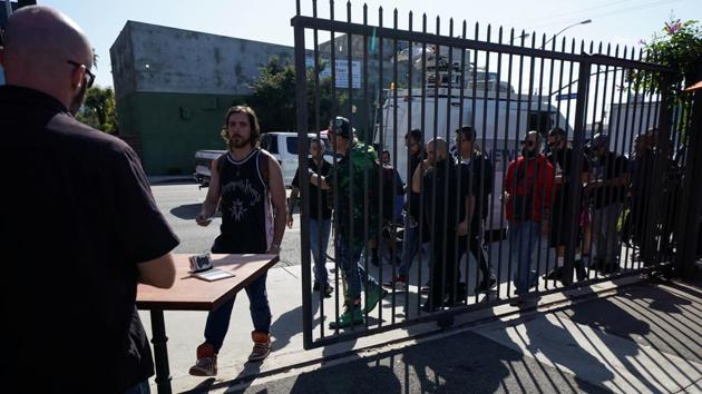 People line-up for the opening of Lowell Farms. The restaurant offers diners an array of weed products and hopes to rival Amsterdam's famed coffee shops. The much-hyped 240-seat establishment is open to people 21 and over, who can order from a cannabis menu just like they would a wine bottle. (Mike Blake / REUTERS)