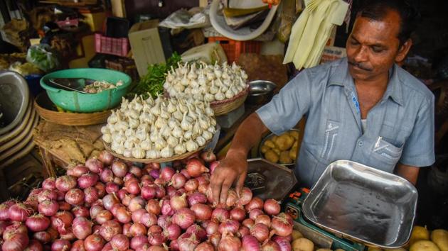 A vendor at Kothrud in Pune, Maharashtra. “The government could be caught in a dilemma, as while it seeks to keep food inflation contained, it also has a promise to raise farm incomes,” said Jason Yek, Asia Country Risk Analyst at Fitch Solutions. “Any measure to artificially depress the price of onions could spur a backlash from the onion farmers.” (Sanket Wankhade / HT Photo)